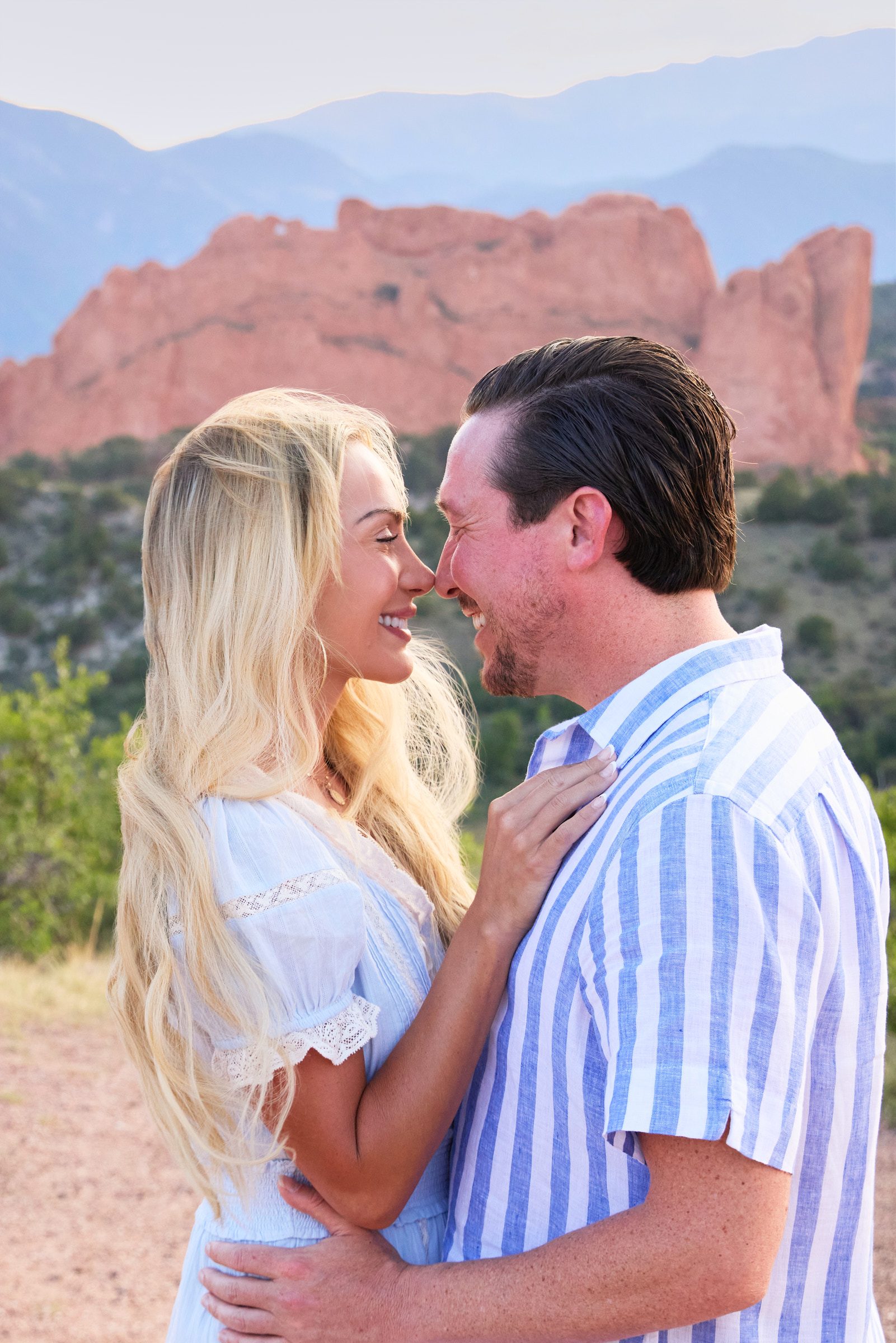 Couple laughing together during engagement session at Garden of the Gods, Colorado Springs